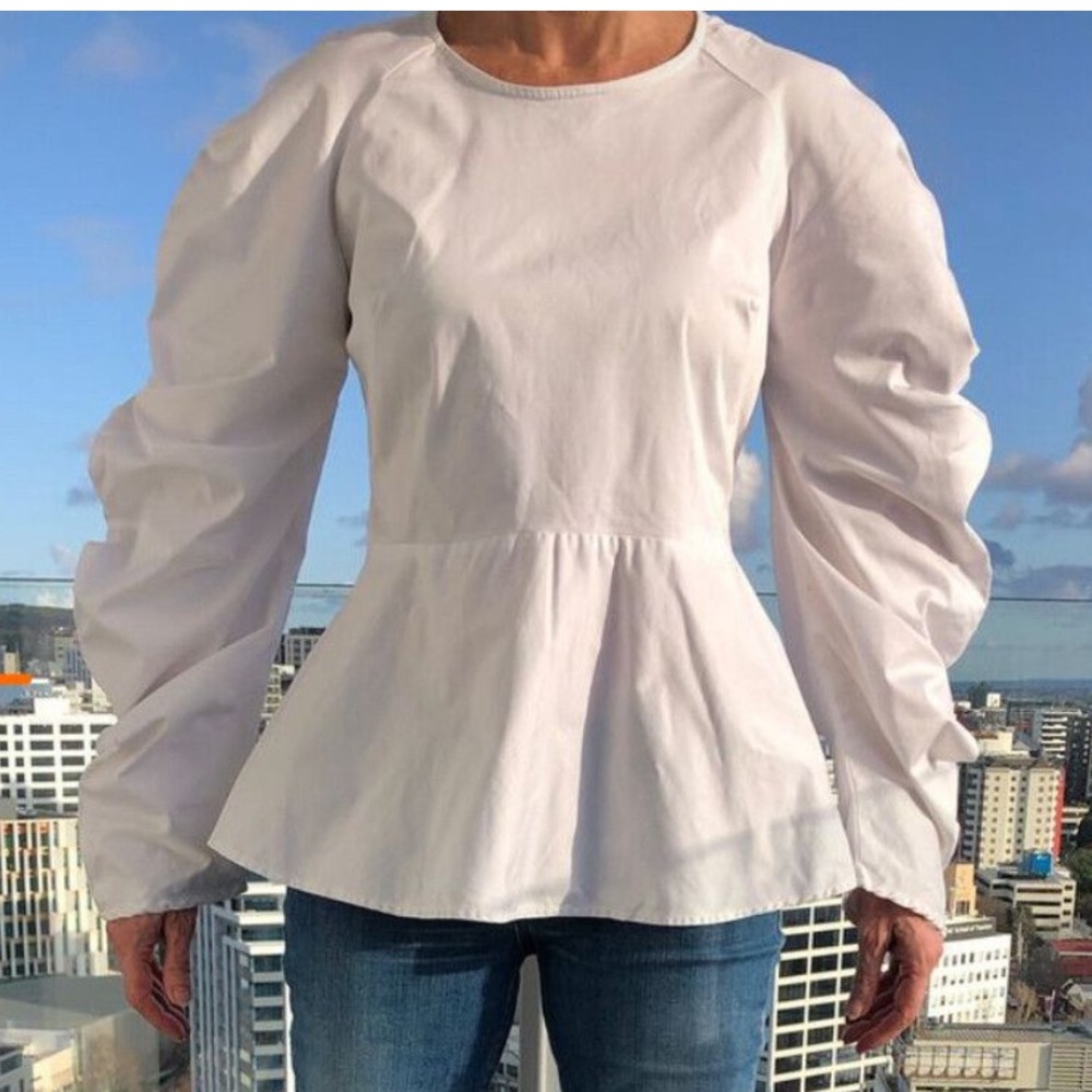 Cream Peplum Blouse with Long Sleeves and Round Neckline